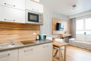 Kuchyň nebo kuchyňský kout v ubytování ActivPark Apartments