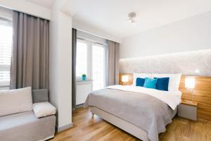 Postel nebo postele na pokoji v ubytování ActivPark Apartments