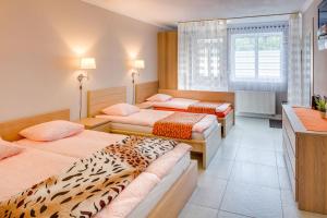 Postel nebo postele na pokoji v ubytování Apartements Studio 964