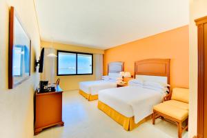 Voodi või voodid majutusasutuse Occidental Tucancún - All Inclusive toas