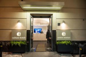 an entrance to a building with the entrance to culture hotels at Culture Hotel Centro Storico in Naples