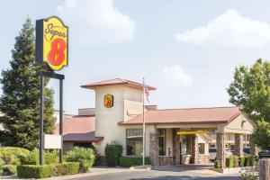 a fast food restaurant with a sign in front of it at Super 8 by Wyndham Corning in Corning