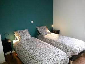Łóżko lub łóżka w pokoju w obiekcie Pause Messines Chez Anne-Marie