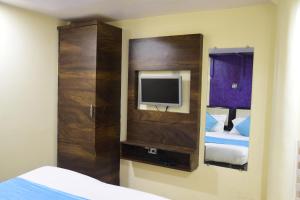 Postel nebo postele na pokoji v ubytování Hotel K.C Residency