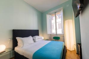 Postel nebo postele na pokoji v ubytování Hotel la Scala