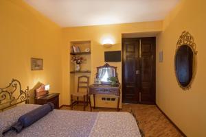 Postel nebo postele na pokoji v ubytování B&B Contrada dei Giardini