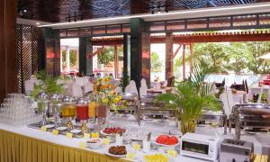 a buffet line with food on a table at Kim Hoa Resort in Phu Quoc