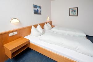 Postel nebo postele na pokoji v ubytování Landhaus Schiestl