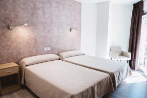 Postel nebo postele na pokoji v ubytování Hotel Celymar