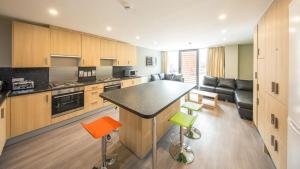 a kitchen with a large island in a room at Unite Students - Salisbury Court in Edinburgh