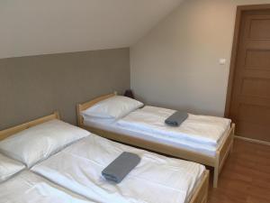 Postel nebo postele na pokoji v ubytování Chata Hluchavka II + 21 fotografií