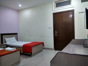 Hotel Raj Palace客房内的一张或多张床位
