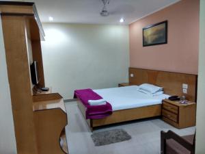 Hotel Raj Palace客房内的一张或多张床位