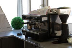 a coffee maker sitting on top of a kitchen counter at Hostel BellaVista in Koper
