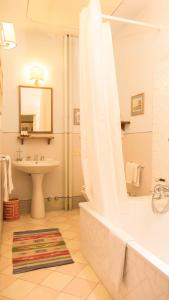 a bathroom with a shower and a sink and a tub at Residenza Johanna I in Florence