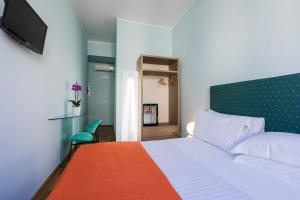 Postel nebo postele na pokoji v ubytování Hotel la Scala
