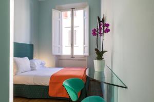 Postel nebo postele na pokoji v ubytování Hotel la Scala