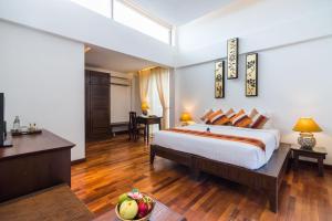 Postel nebo postele na pokoji v ubytování Samui Paradise Chaweng Beach Resort