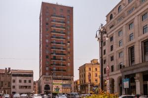 a city street with tall buildings and a street light at PADOVA TOWER 13TH FLOOR in Padova