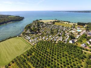 an aerial view of a park next to the water at Camping de Keranterec in La Forêt-Fouesnant