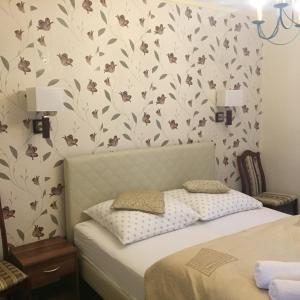 Łóżko lub łóżka w pokoju w obiekcie Villa Almira