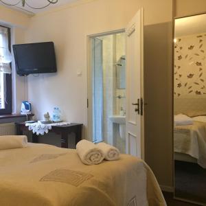 Łóżko lub łóżka w pokoju w obiekcie Villa Almira