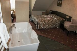 Posteľ alebo postele v izbe v ubytovaní Hotel Monet & Rubbens