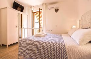 Voodi või voodid majutusasutuse White Charme Rooms toas