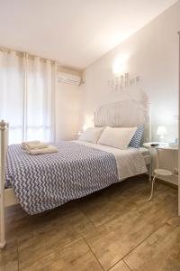 Voodi või voodid majutusasutuse White Charme Rooms toas