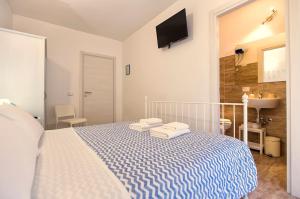 Voodi või voodid majutusasutuse White Charme Rooms toas