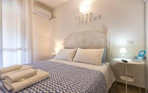 Voodi või voodid majutusasutuse White Charme Rooms toas