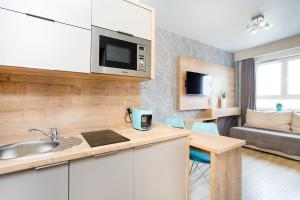 Kuchyňa alebo kuchynka v ubytovaní ActivPark Apartments