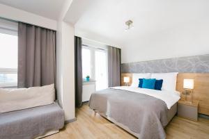 Posteľ alebo postele v izbe v ubytovaní ActivPark Apartments