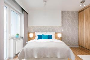 Posteľ alebo postele v izbe v ubytovaní ActivPark Apartments