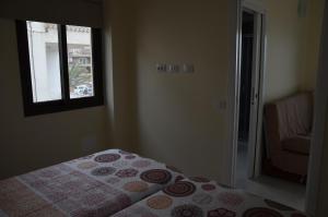 A bed or beds in a room at Sol y Playa