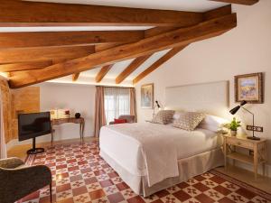 Posteľ alebo postele v izbe v ubytovaní Hotel Gloria de Sant Jaume