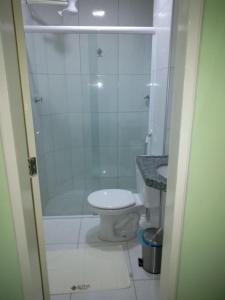 a bathroom with a shower and a toilet and a sink at Hotel Letiva Arco in Sobral
