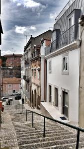a group of buildings on a city street at Sweet Spot @ Alcântara in Lisbon