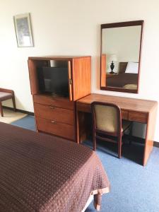 TV a/nebo společenská místnost v ubytování Village Motel