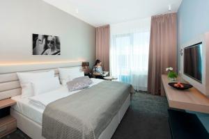 Letto o letti in una camera di Grid Hotel