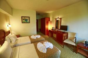Postel nebo postele na pokoji v ubytování Kayhanbey Hotel