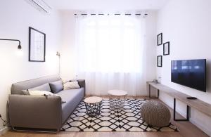 TV a/nebo společenská místnost v ubytování Appartements Dom Vaissette
