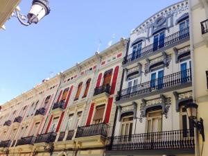 a large building with many windows and balconies at Valencian Dreams in Valencia