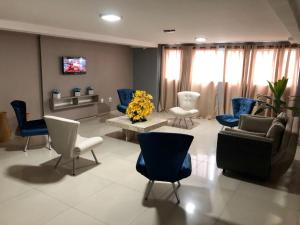 TV a/nebo společenská místnost v ubytování Anjos Praia Hotel
