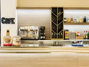 a kitchen with a counter with aasteryasteryasteryasteryasteryasteryasteryasteryastery at Hotel Carbonell in Llança
