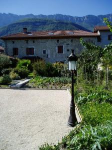 a black street light in front of a house at La Maison d'Euterpe in Sainte-Marie-dʼAlloix