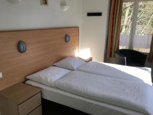 Postel nebo postele na pokoji v ubytování Parkhotel Villa des Effats Vielsalm