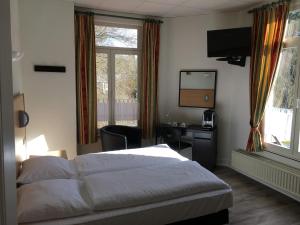 Postel nebo postele na pokoji v ubytování Parkhotel Villa des Effats Vielsalm