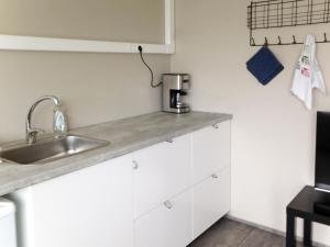 Kuchyň nebo kuchyňský kout v ubytování Natura Apartments + 18 fotografií