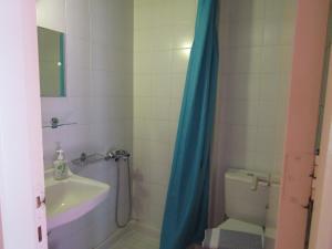 A bathroom at Barbati Beach Apartments
